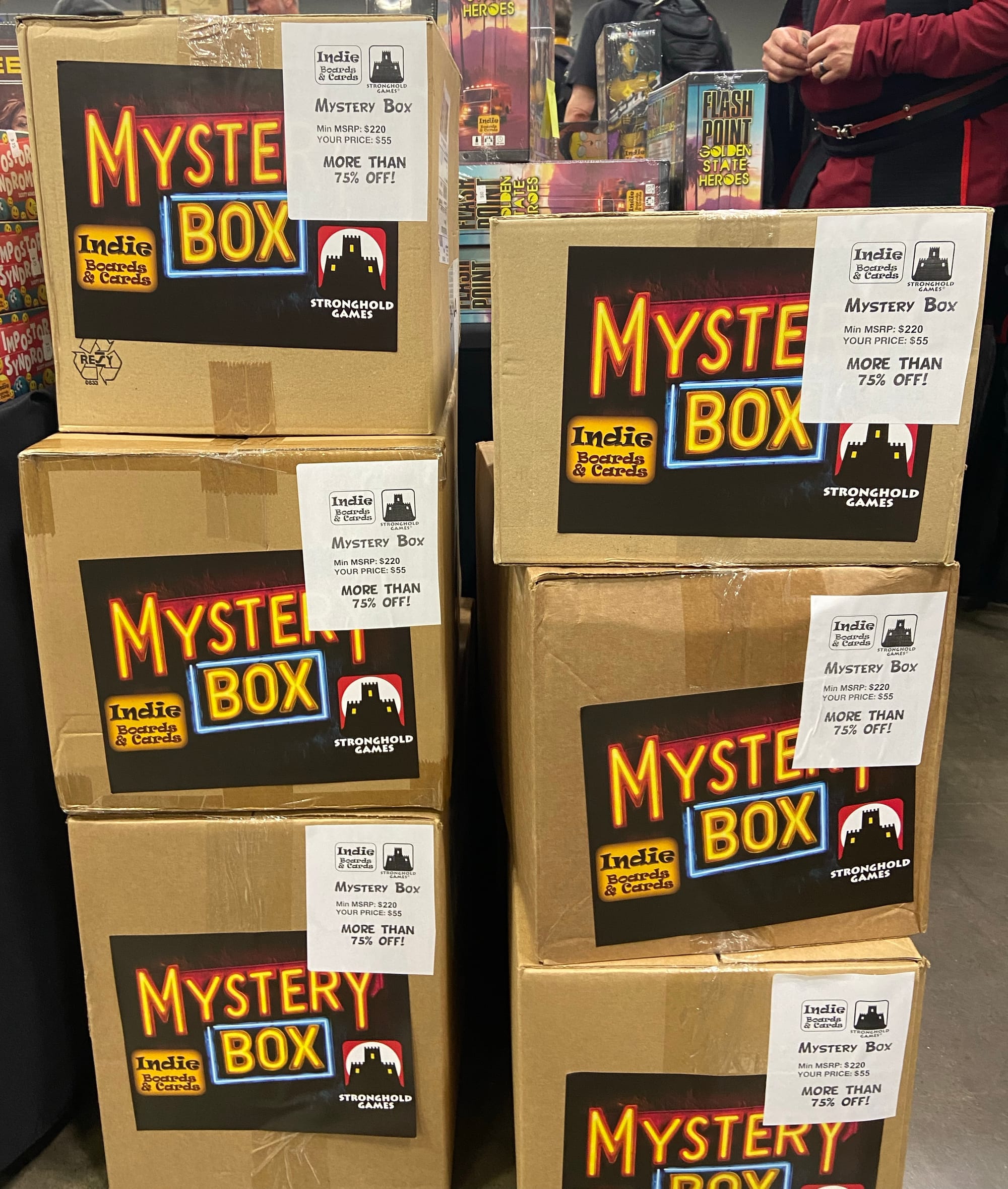 Two stacks of cardboard boxes labeled "Mystery Box - min MSRP $220, your price $55"