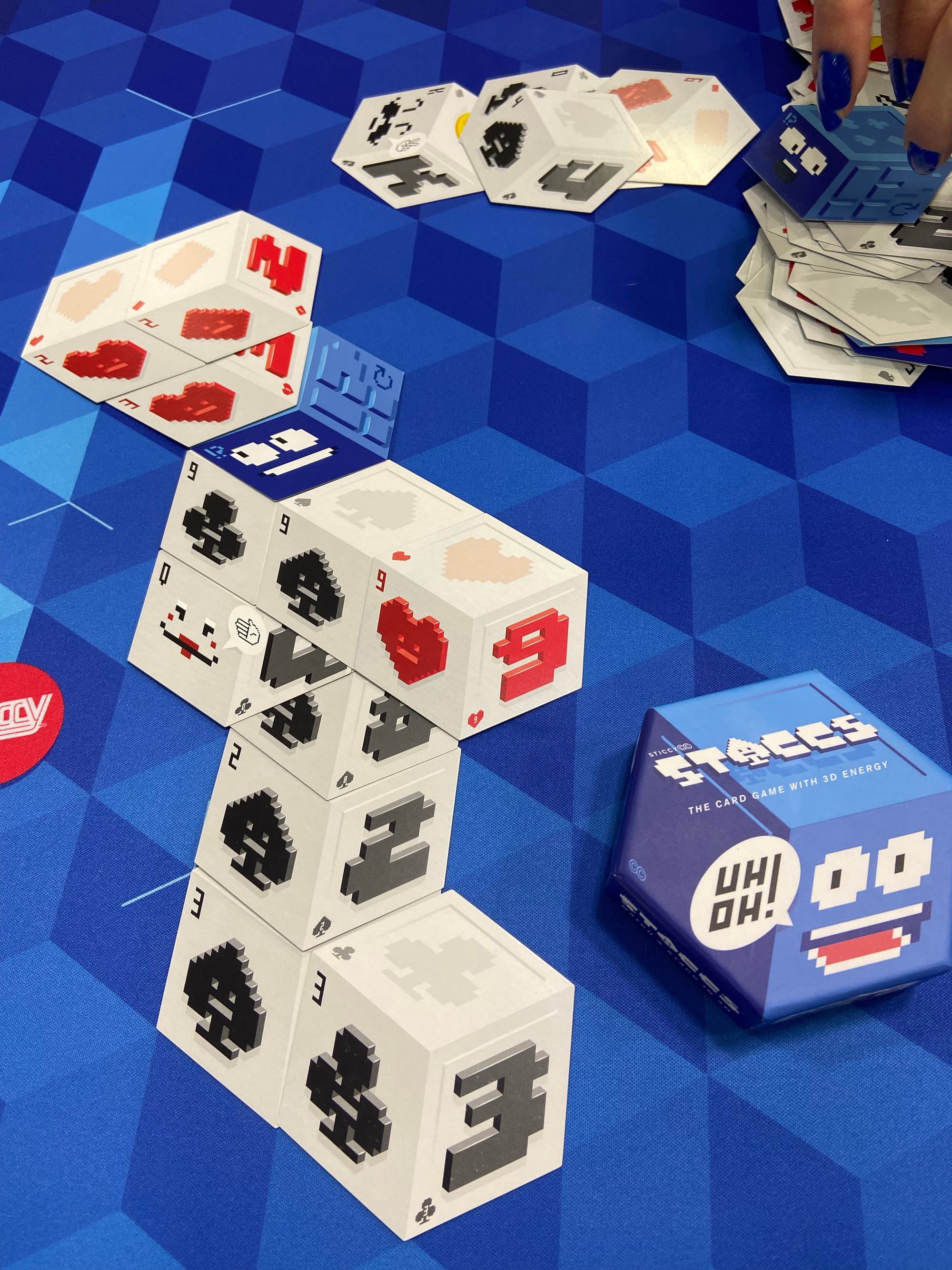 Gameplay example for STACCS, which features hexagonal cards that look like 3D boxes