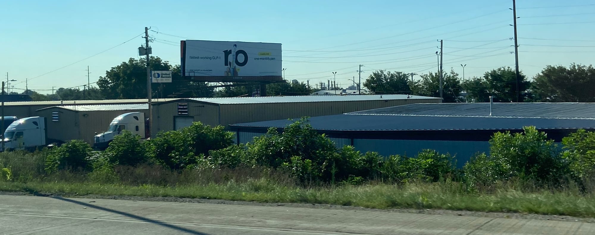 A grainy image of a billboard featuring a GLP-1 product.