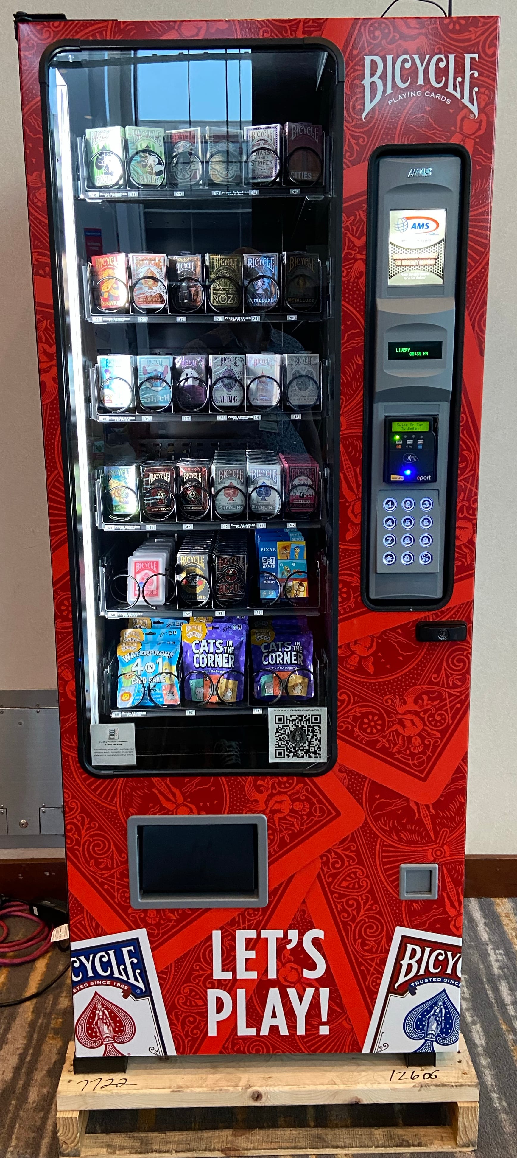 A vending machine features two dozen card decks and card games