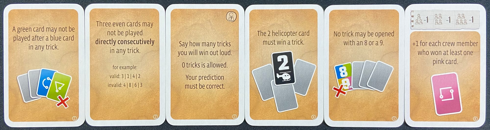 Sample tasks: "A green card may not be played after a blue card in any trick", "Three even cards may not be played consecutively in any trick", and "The 2 helicopter card must win a trick"