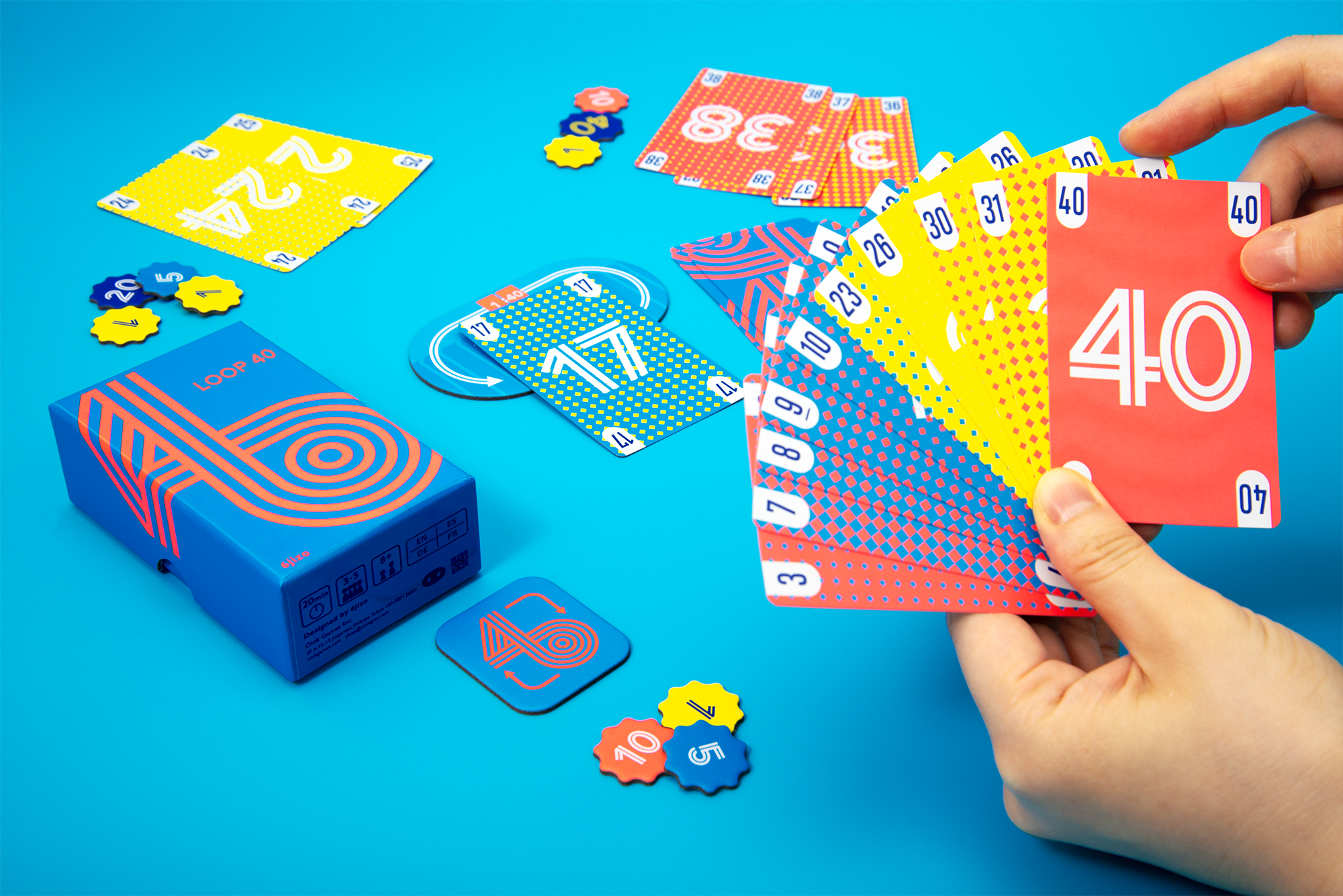 In an example of gameplay, the 17 was the lead card. One player has laid down 24-25, and another has played 36-37-38. Maybe you want to play 7-10 from your hand to win the round?