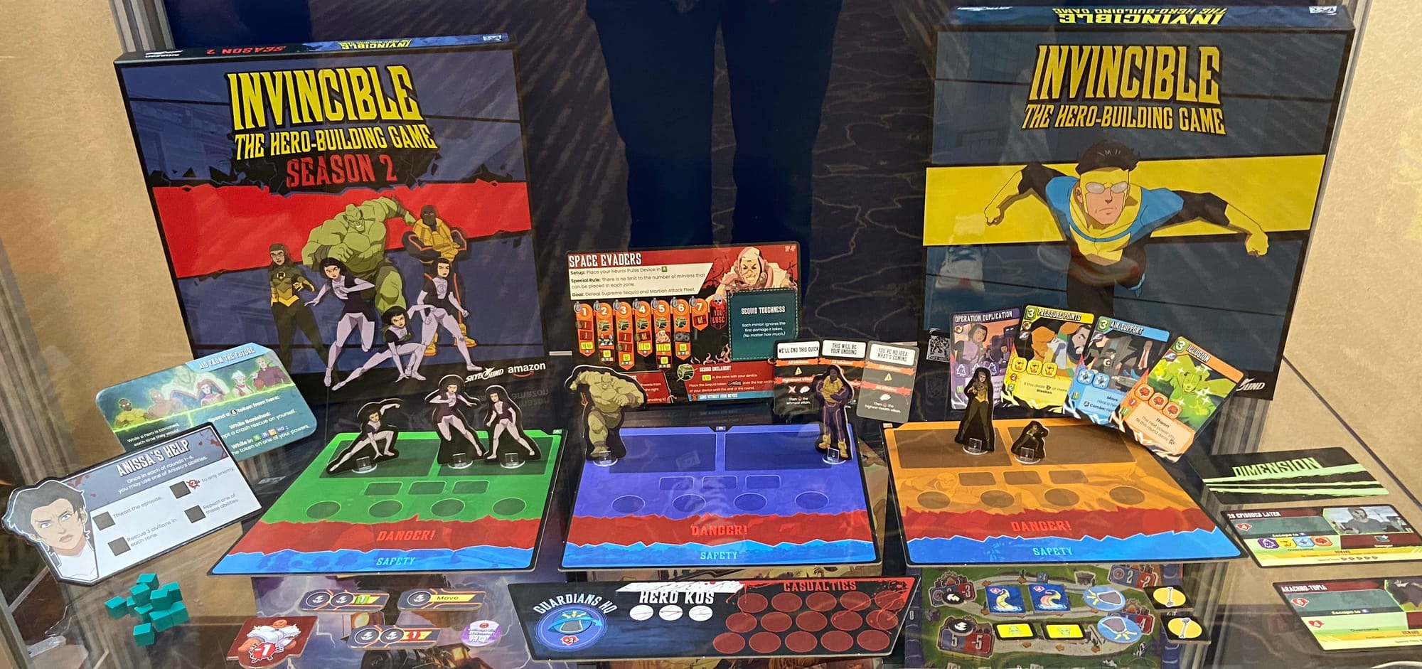 Cardboard standees, characters cards, and game boards for Invincible: The Hero-Building Game – Season 2