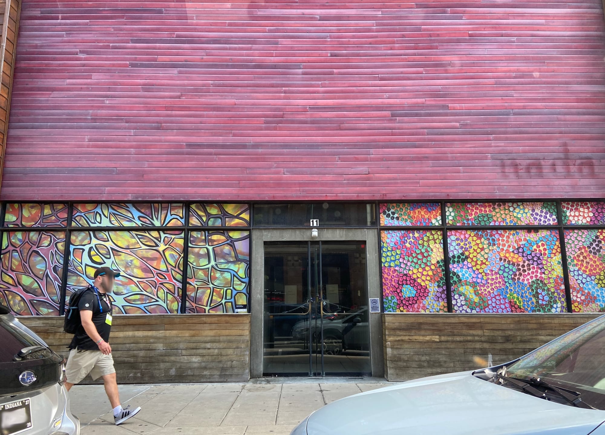 The colorful empty storefront of an out-of-business restaurant in Indianapolis called "nada", with the letters now missing, leaving only a ghostly impression behind.