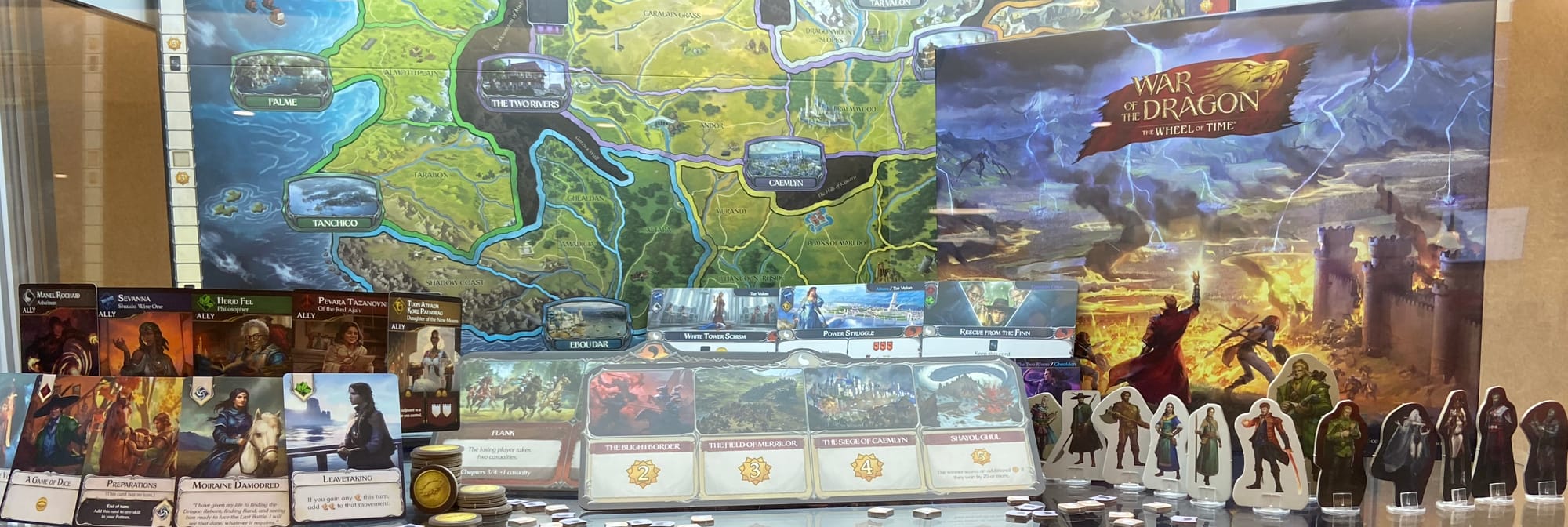 Components for War of the Dragon: The Wheel of Time: cardboard standees, cards, a giant gameboard, chits, and more.