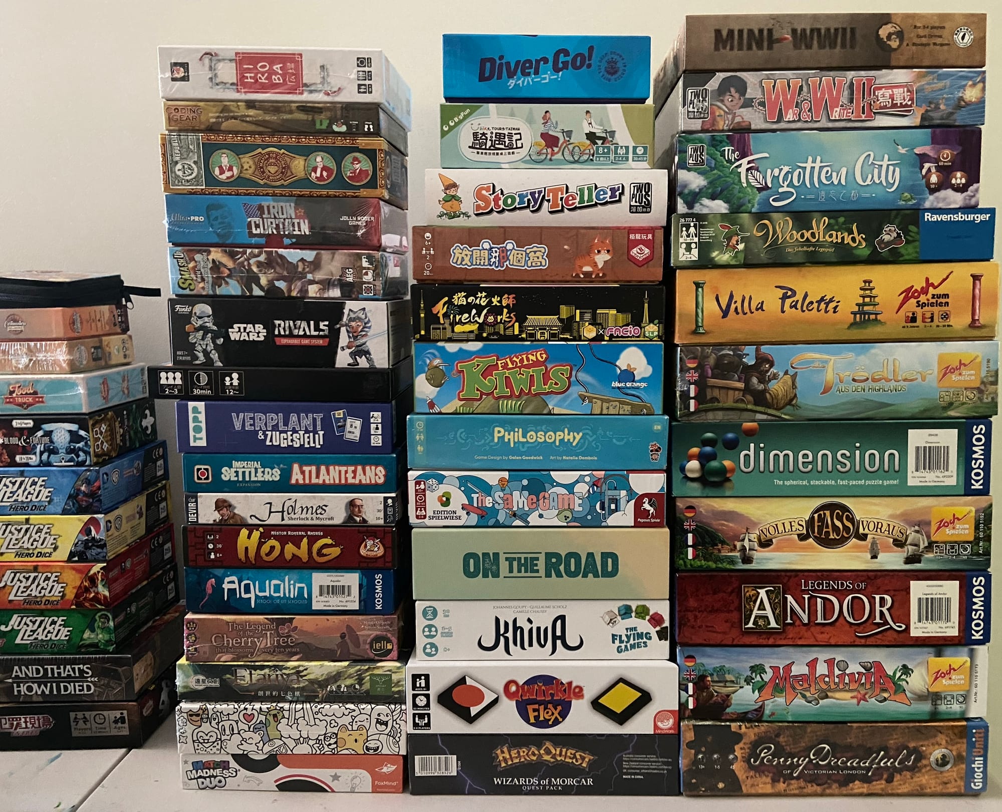 Four stacks of games are on a table.