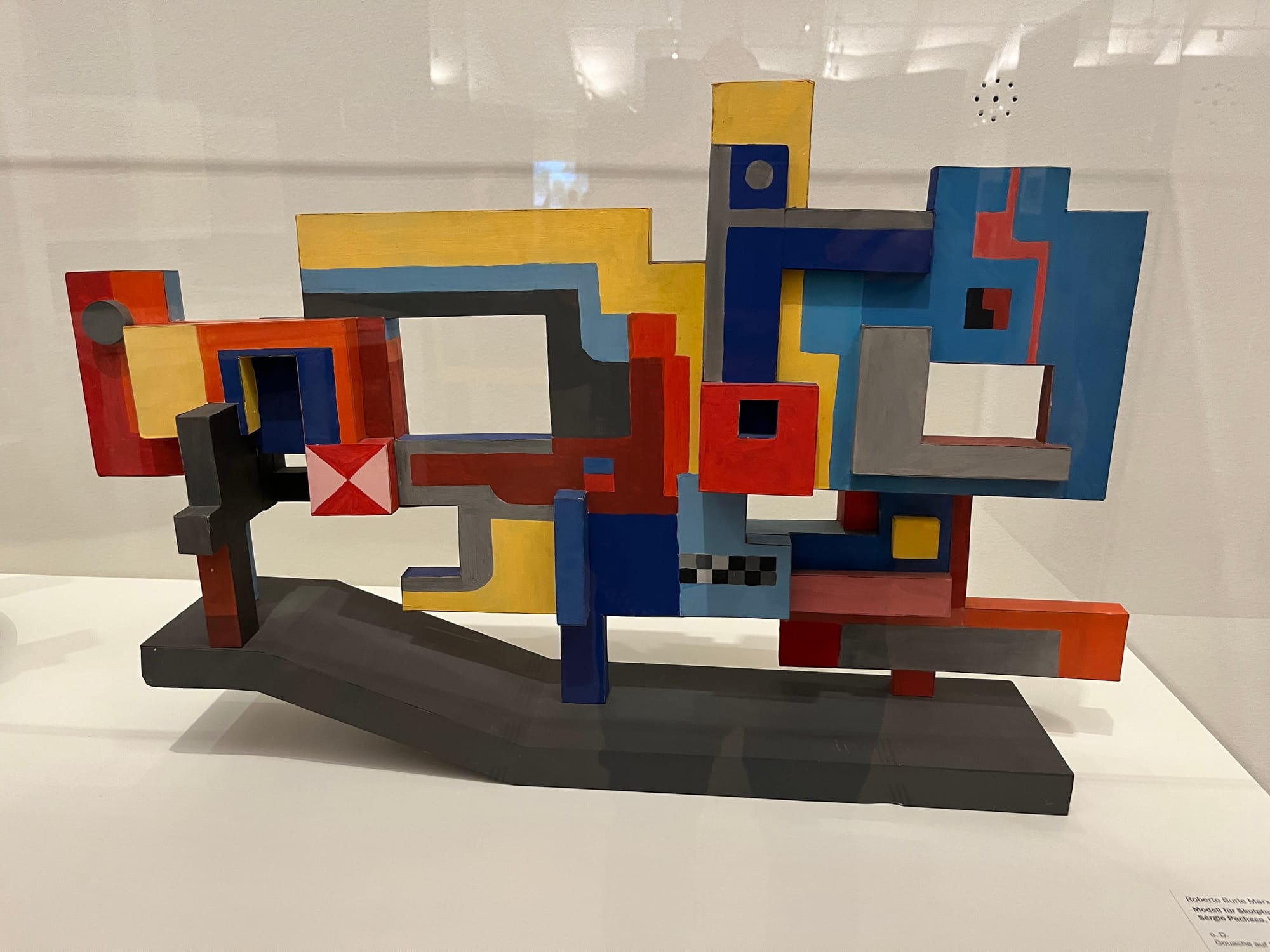A multi-colored wooden model in geoometric forms.