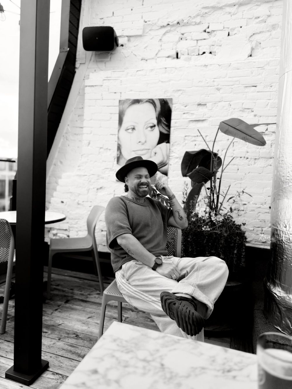 Theo Tams in a café, black and white