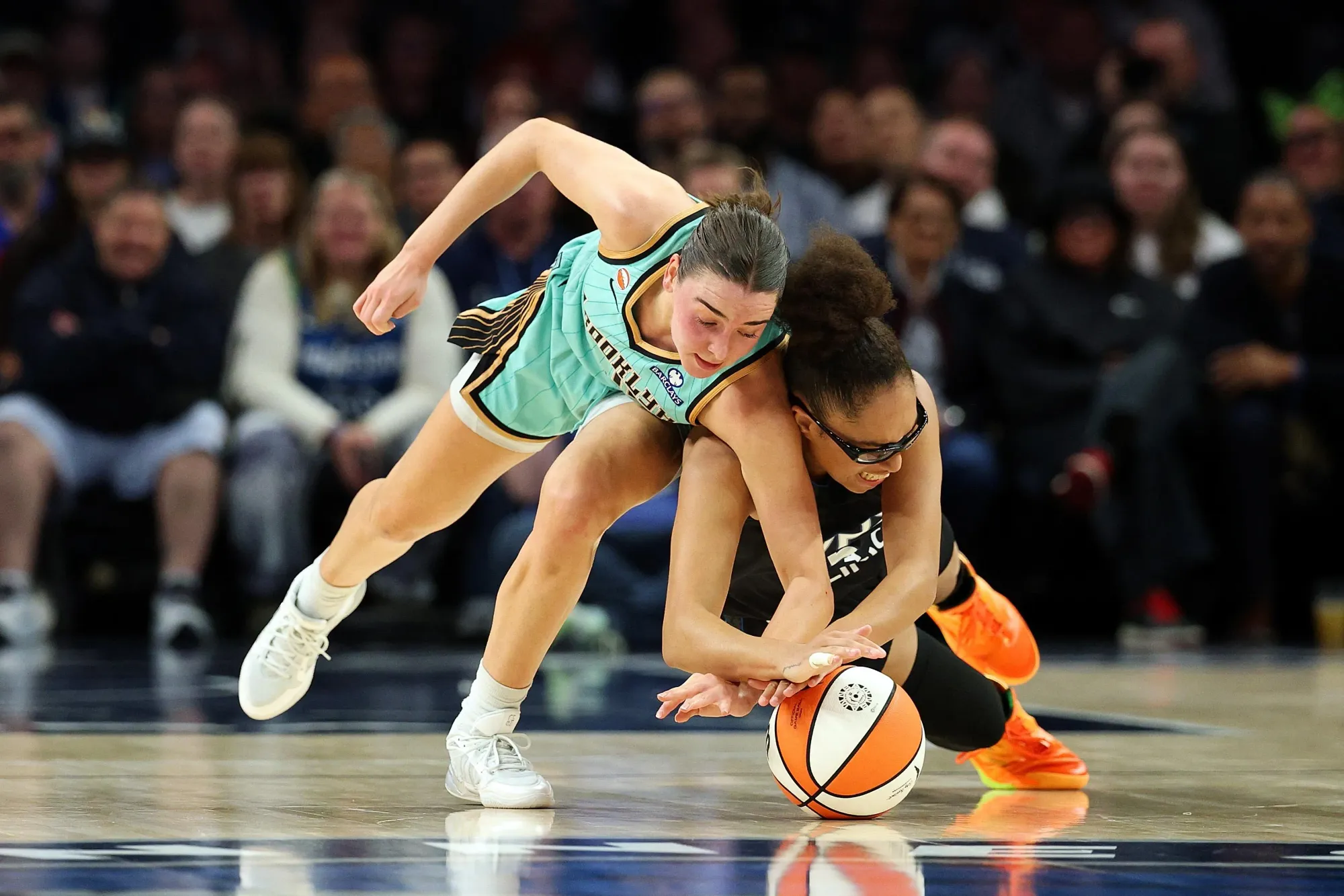 Astier and Miles diving for the ball