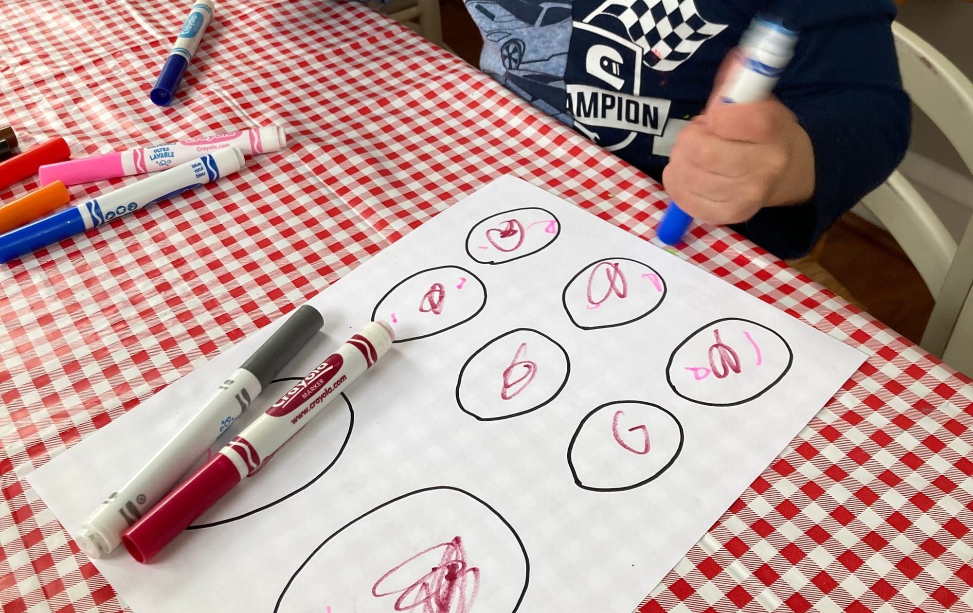 Eggs drawn on a sheet of paper, then decorated in magic marker by a young child.