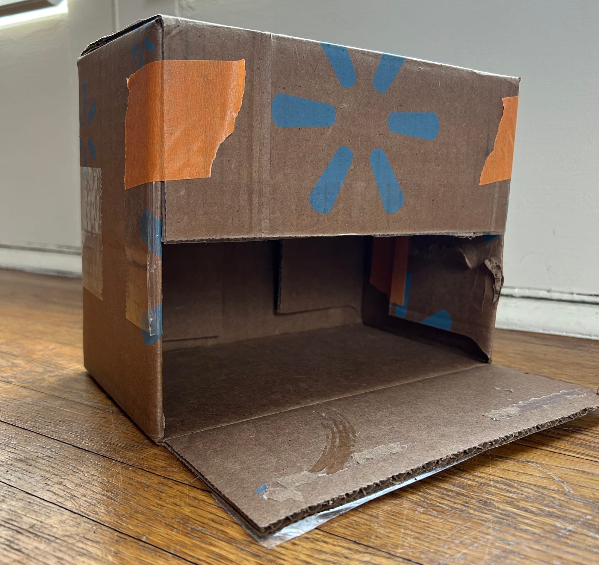 A cardboard box garage (the door opens the wrong way, but the kids don't care!)