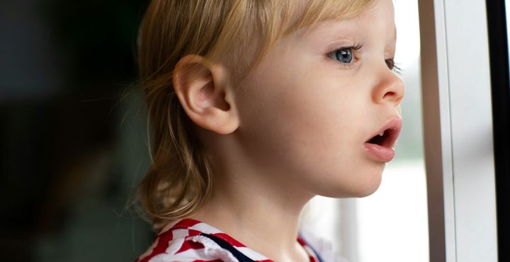 A close-up of a child whose expression says, "I'm not sure what's next."