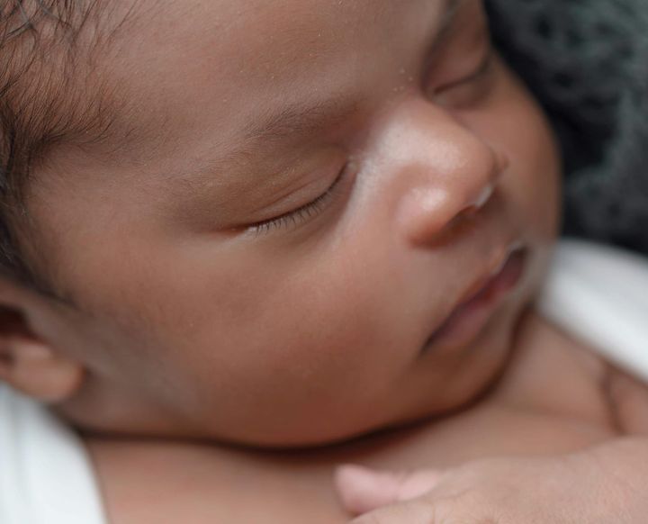 A very new baby, sleeping. 