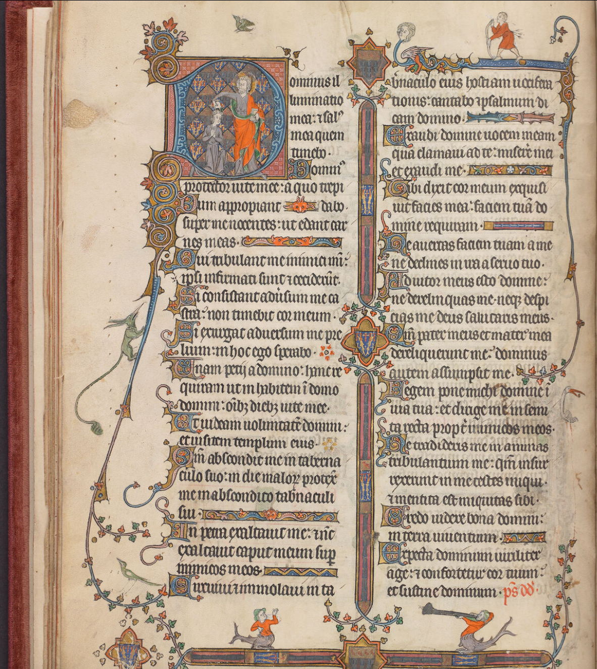 A richly decorated manuscript page with an inhabited initial, vines and a few hybrid creatures
