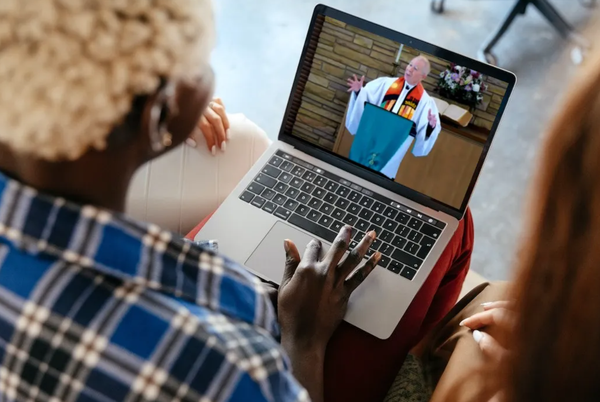 black woman with friends watching preacher online