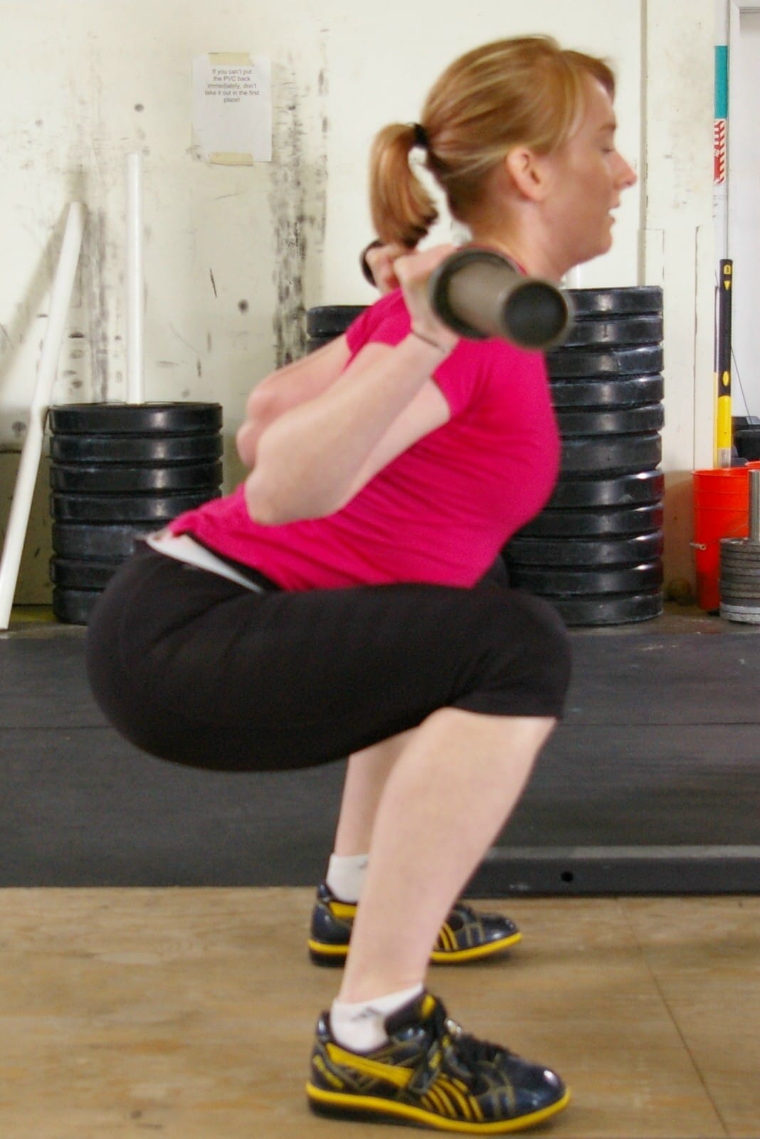 The low bar back squat is the least specific squat variant for the Olympic lifts.  It is so far removed that I would strongly recommend against it's use at all for leg strength development in weightlifting.  Note the clear difference in torso, hip, and knee angles.  Training the low bar back squat will likely lead to poor receiving positions for both the snatch and clean.