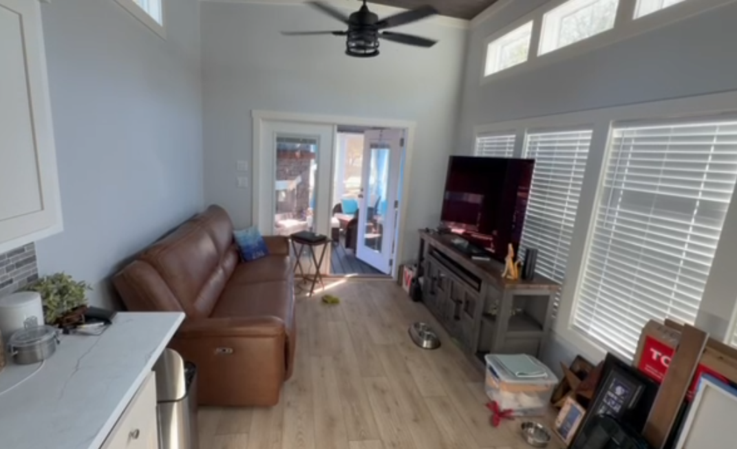 Interior view of 399 square foot tiny house showing living space and kitchen