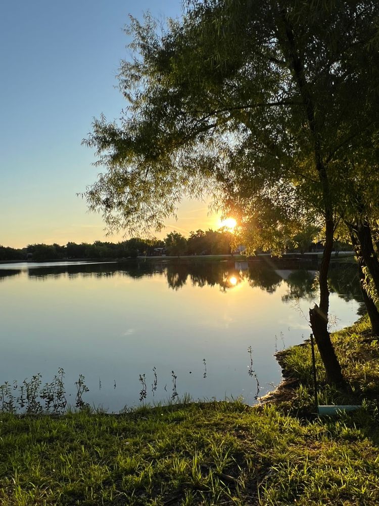 Peaceful lake sunset at tiny home community celebrating freedom day after house sale completion
