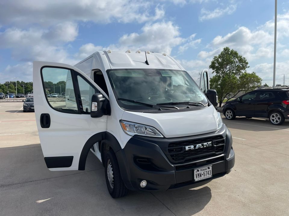 White rental van in parking lot on moving day.