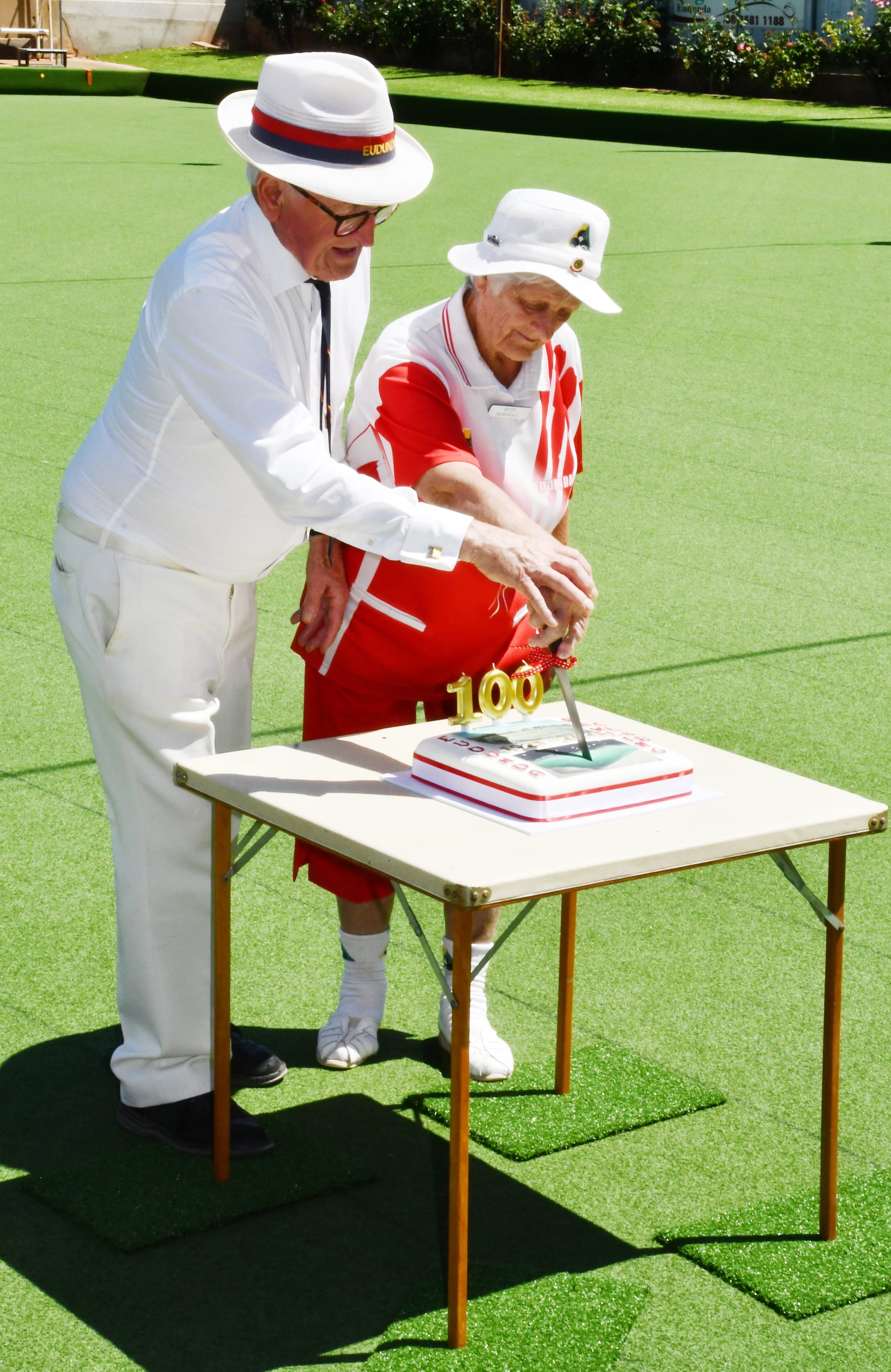 Bob Leditschke and Betty Marschall cutting the cake.