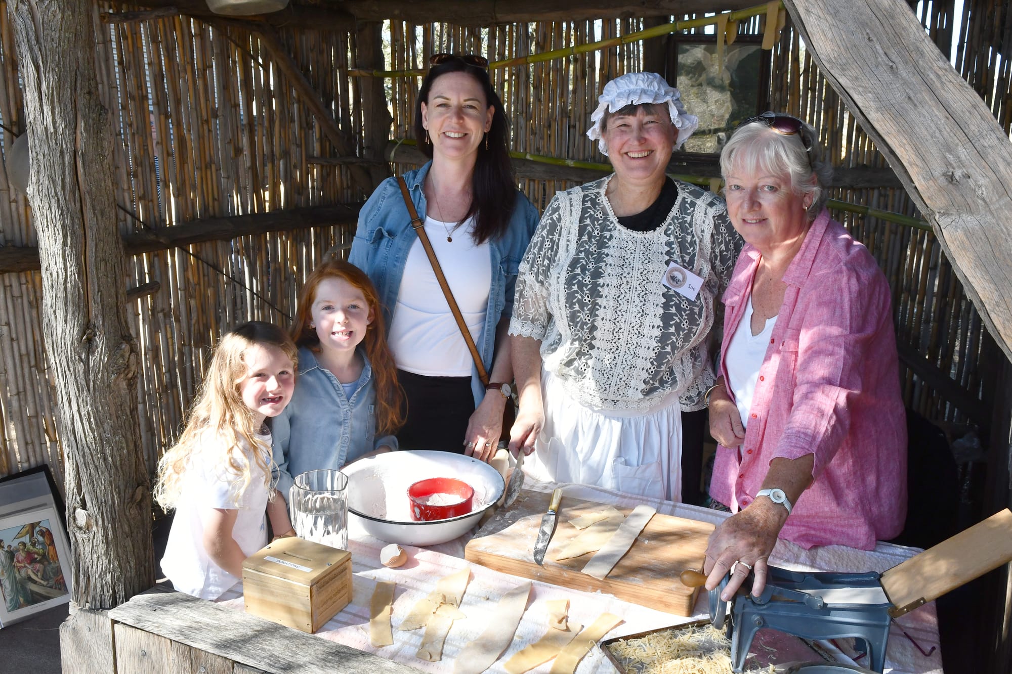 Amayah Schulz, Atarah Noll, Kellie Drummond, Sue Nicolai and Janet Roenfeldt learn traditional noodle making.