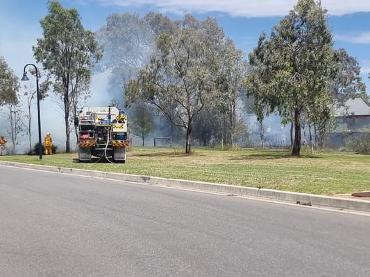 Grass fire in residential area