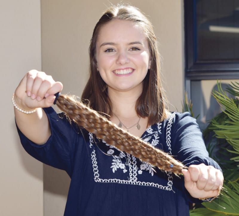 Cousins crop their locks for a cure post image