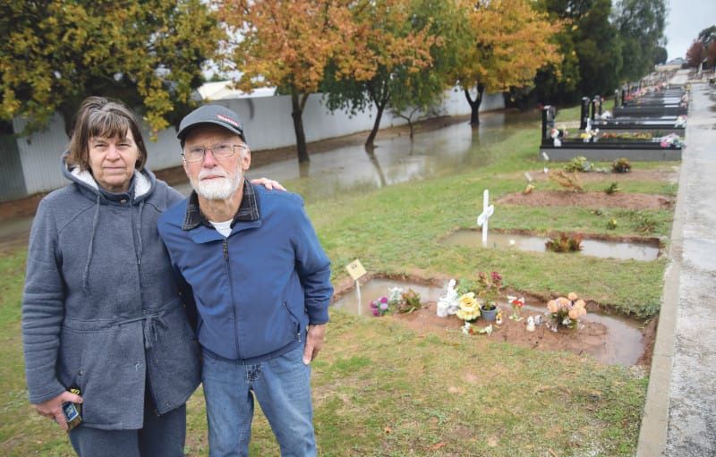 Flooded graves cause distress post image