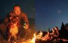 Campsite Banter Briefly Pauses As Mates All Give In To Masculine Urge To Stare Silently Into Roaring Fire