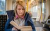 Local Woman Politely Reading On Train Is Getting Through The Most Filthy Smut Right Now