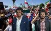 Bret And Jemaine Spotted Stuck In Between Anti-Iran Protesters and Iranian Football Fans