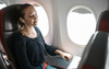 Flight Passenger Pastes On Polite Smile To Signal She’s Awake And Ready For Biscuit