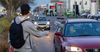 Staff Of Minor Party Senators Seen Cleaning Windscreens At Canberra Traffic Lights