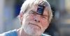 Entrepreneurial tramp has PayPass™ terminal installed on forehead