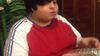 Obese Nephew Making Light Work Of The Fruit Cake