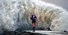 Cyclone Debbie Stands Still As Johnathan Thurston Slowly Walks Down The Strand