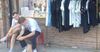 Unattended Boyfriends Bond Over Memes While Placed Outside Female Fashion Outlet