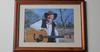 Framed Photo Of Uncle Slim Takes Pride Of Place Above Fridge In Murri Grandma’s Kitchen