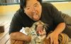 Animal-Loving Hunk Graces Tinder With Photo Of Him Petting A Sedated Tiger In Thailand