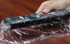 Filo Household Extends Shelf Life Of TV Remote By Sealing It In Glad Wrap While Still Fresh