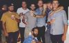 Freakishly Tall Mate Pops A Squat In Group Photo