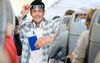 Report: Eccentric Loudmouth Walking Down Plane Aisle Coming Straight For Seat Next To You