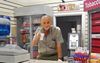 Local Papou Behind Counter Of Greek Milk Bar Just Blatantly Punching A Durry Inside
