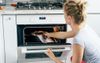 “Wife Material” Whispers Local Woman Taking Half-Burnt Betty Crocker Fudge Cake From Oven
