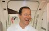 New Qantas In-Flight Menu Launch Hits A Snag As Neil Perry’s Iconic Ponytail Gets Stuck In The Door