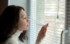 Woman Waiting For Online Shopping Delivery Camping Out At Door Like IRA Sniper 