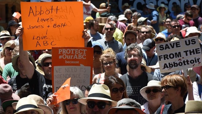 Thousands gather for a Save the ABC rally at Town Hall in Sydney, Saturday, Nov. 22, 2014. The Abbott Government has broken an election promise to not cut funding to the ABC and SBS. (AAP Image/Dean Lewins) 