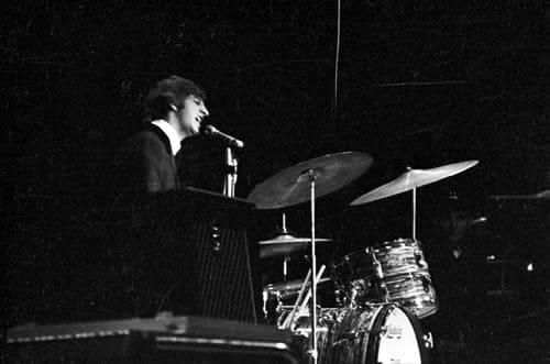 A young Ringo Starr on stage with The Beatles, singing the one song that they ever allowed him to sing solo - Yellow Submarine