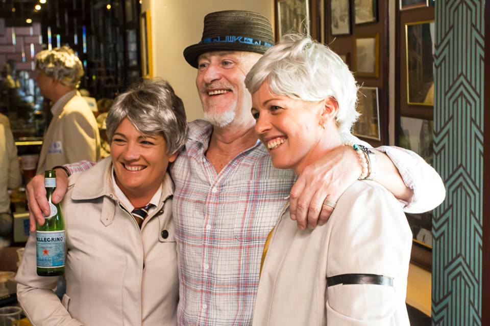 Billy "The Twelfth Man" Birmingham poses with several groupies this morning