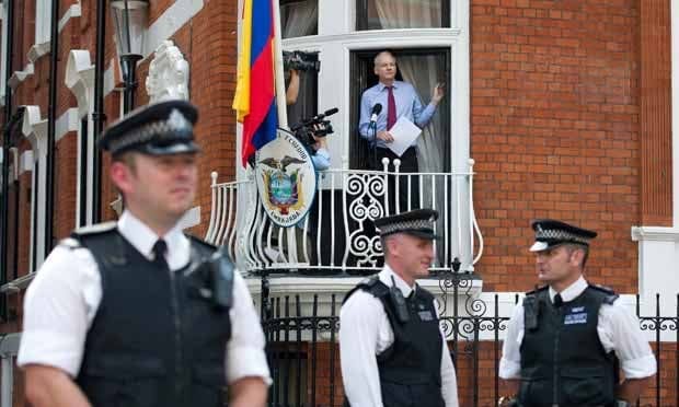 Assange addresses his enemies and supporters from the safety of a balcony at the Ecuadorian embassy in London